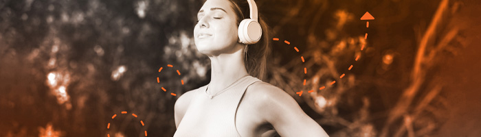 A person wears earphones while exercising.