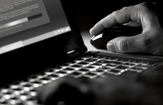 Person working on computer to protect data privacy